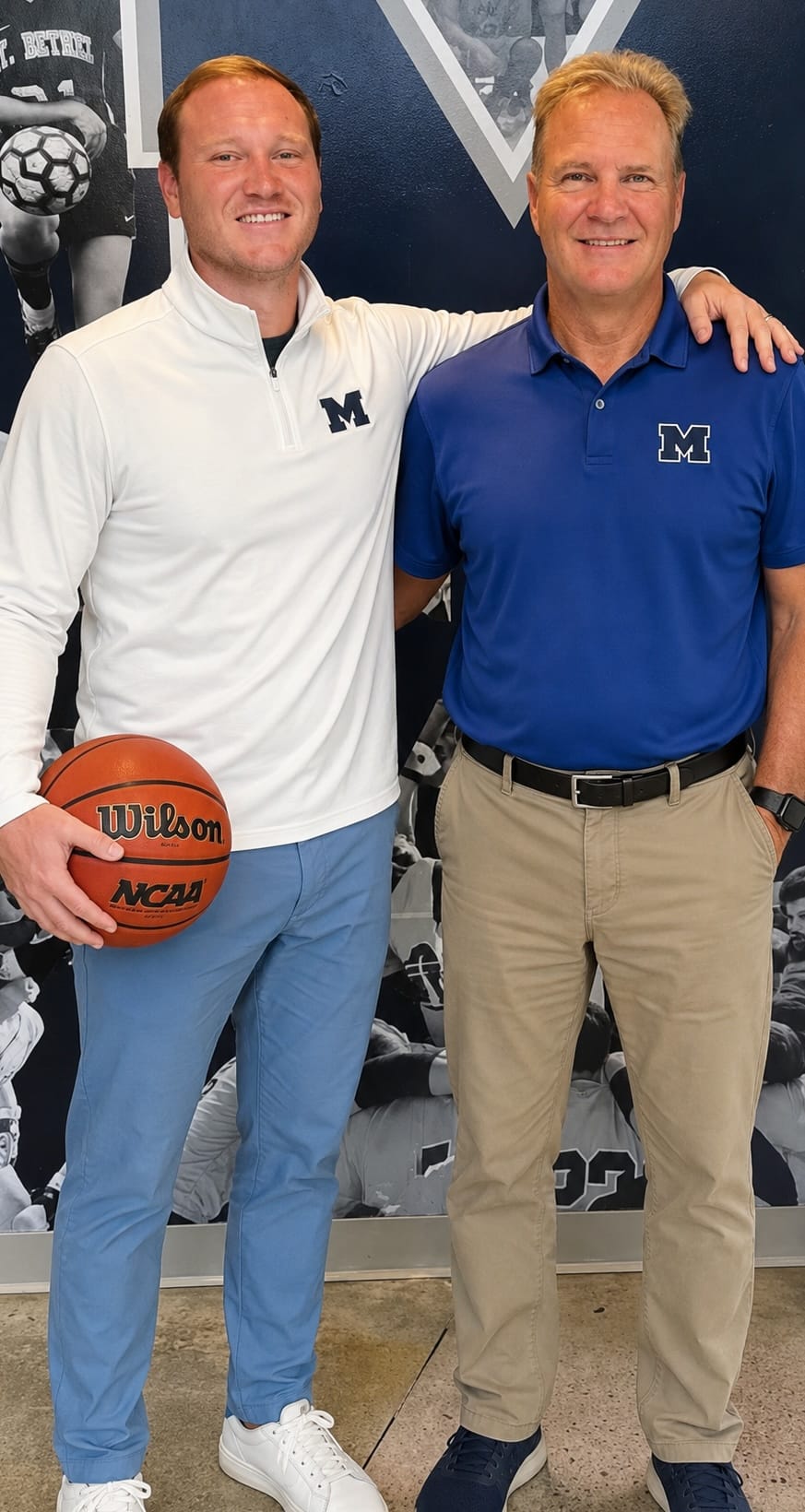 Coach Cal Boyd standing with his son and fellow coach Cam Boyd